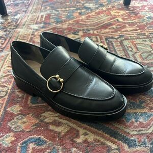 Black Leather Stuart Weitzman Women’s Loafers with Gold Accent